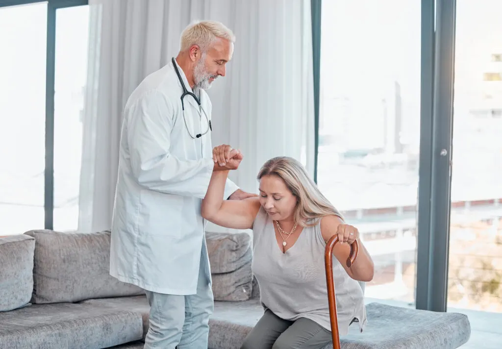 Baston Nasıl Kullanılır? – helping hand doctor and woman with cane in home v 2023 11 27 04 59 06 utc